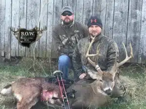Bow hunters with a deer catch